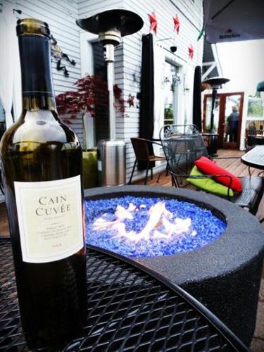 Enjoy a nice bottle of wine at one of our many tables on the deck 