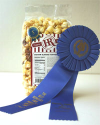 HR Poppin' Snacks received the Blue Ribbon for their exclusive Cashew Almond Toffee.  The ribbon was awarded at the Best Nebraska Food Products Contest in the Candy and Nuts division.