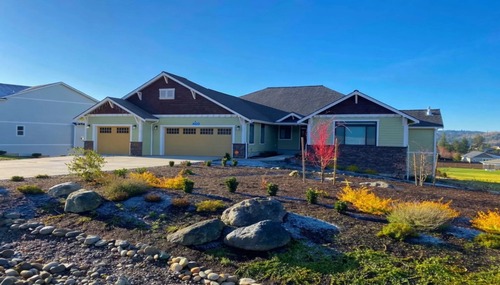 Newly constructed custom home with professional landscaping completed by Dihedral Builders in Anacortes, Washington.