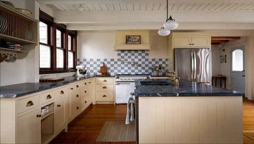 Custom kitchen remodel featuring shaker cabinets, marble countertops, and a large island by Dihedral Builders in Anacortes, WA.