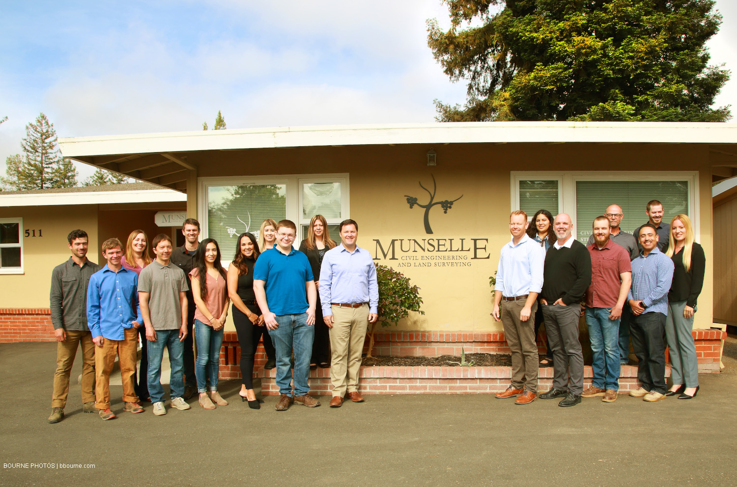 munselle civil engineering team standing in front of office building. 511. munselle civil engineering and land surveying